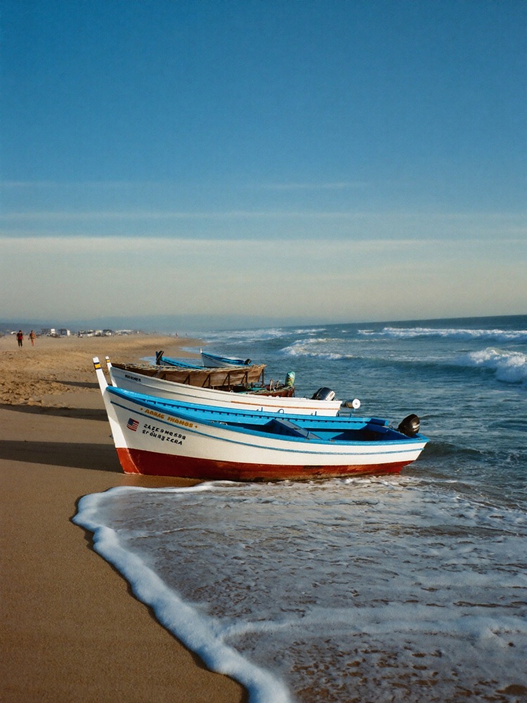 Traditional fishing boats on a calm Spanish beach